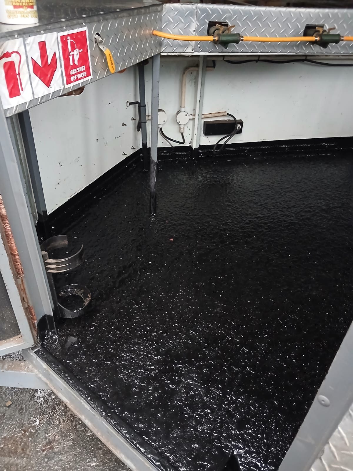 Catering trailer with a black rubberised floor