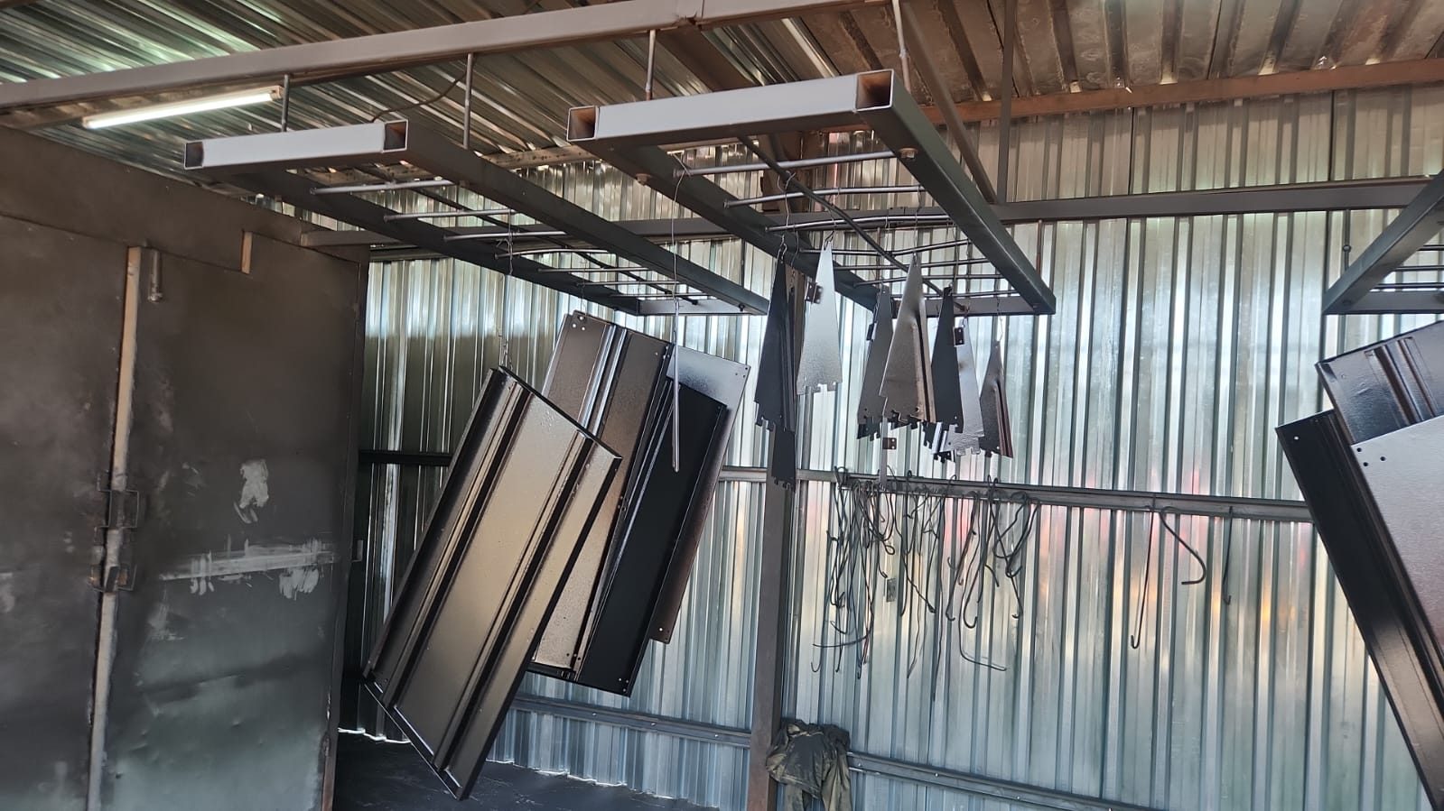 Powder coating oven and hanging line in the workshop