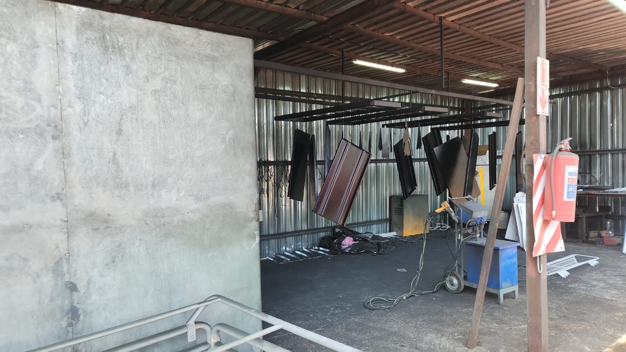 Powder coating oven and hanging line in the workshop